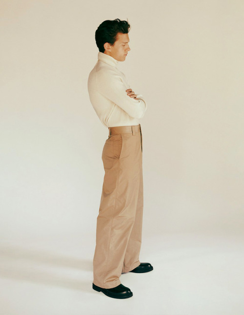 meninvogue:Tom Holland photographed by Fanny Latour-Lamber for GQ Style. Tom wears turtleneck and shoes by Brunello Cucinelli, pants by Valentino, his own watch by Patek Philippe