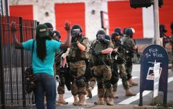 stfueverything:  invisiblelad:  micdotcom:  Days after Michael Brown’s death, Ferguson looks like a war zone  A vigil held for Michael Brown, an unarmed black teenager gunned down by Ferguson, Mo., police on Saturday in disputed circumstances, turned