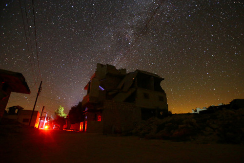 yahoonewsphotos: Starry nights and empty streets in Syria The stars fill the night sky over the eeri