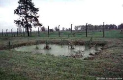 This innocuous looking scene is actually the disposal pit for the ashes of people murdered at Auschwitz and incinerated at Crematorium IV. Even though cremation negated the need for burial, the sheer volume of the murdered meant that huge pits had to