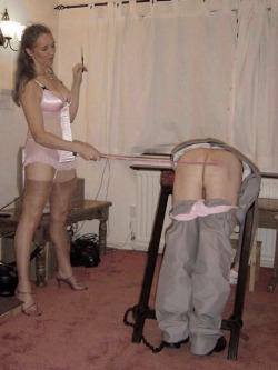 spanking-ladies-naughty-boys:helen59:A bit like Me. Cigarette in one hand and a very active cane in the other. I really love a cigarette then.Helen.and I love to wear panties and get spanked