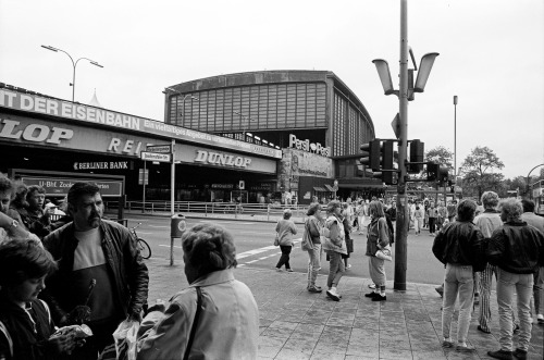 West Berlin Bahnhof Zoo 1986. A teenage fashion display on the right, and on the left, Dunlop tyres 