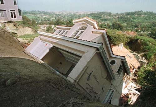 A house crashed into another after El Niño-related mudslides sometime in 1998 in Southern California