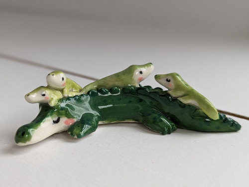 A Crocodile Mom And Her Little Ones