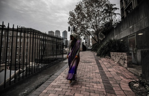 Under the bridge in an everyday saree