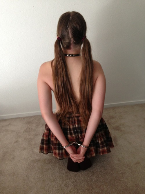 sweet-little-submissive:  Kneeling, cuffed, and ready to serve!