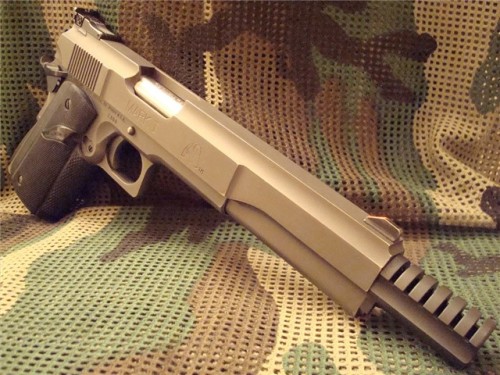just-remington:  la-volpe-bianca:   gunrunnerhell:  LAR Grizzly Longslide Very rare variant of the Grizzly, there were several longslide length options. The Grizzly is an oversized version of the 1911 and uses magnum caliber cartridges normally designed