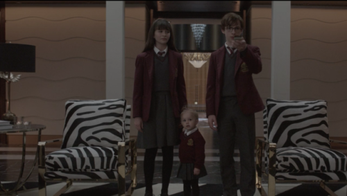 Malina Weissman, Louis Hynes, and Presley Smith as Violet, Klaus, and Sunny Baudelaire in A Series o