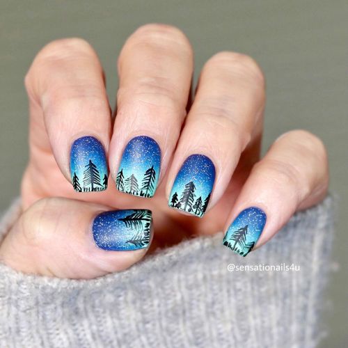 This Hand painted wintery scene I did on my nails today was inspired by a paint that I saw long time