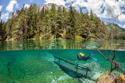 wonderous-world:  Green Lake is located in Tragöss Austria. In spring snowmelt raises the lake level about 10 meters. This phenomenon, which lasts only a few weeks, covers the hiking trails, meadows, trees and everything in between. The result is magical