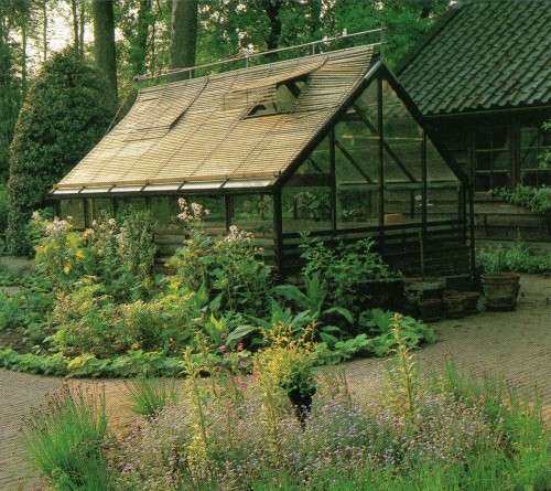 vintagehomecollection:Greenhouse as a feature. in this Dutch garden, the greenhouse has been treated