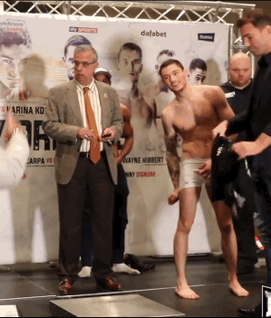 notdbd:Boxer Ben Hall has to strip naked as he weighs in - he has a big smile on