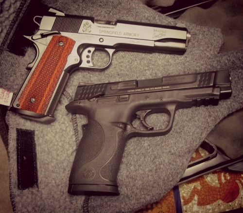 gunsknivesgear:  Springfield 1911 and Smith & Wesson M&P.