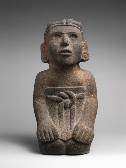 Aztec stone sculpture of a kneeling female figure.  Artist unknown; 15th or early 16th century.  Now