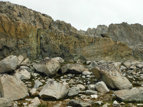 Impressive geology area at Wampum Lake. Light granite boulders and slabs under a ridge of dark intru