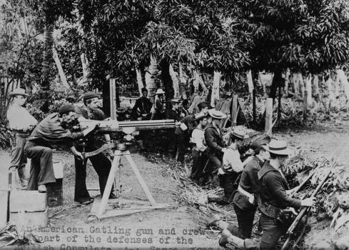 historicaltimes:An American Gatling gun and crew defending the British Consulate. Samoa. 1899. via r