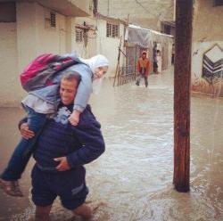 nowinexile:  Daughter: “I don’t want to go to school. I can’t go to school. The streets are flooded. I’ll get wet. There’s no way out” Father: “You’ll go to school even if I have to carry you there every single day. Yalla let’s go”