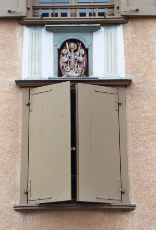 Window Shutter Almost Closed With Religious Carving Above, Le Puy-en-Velay, France, 2005.