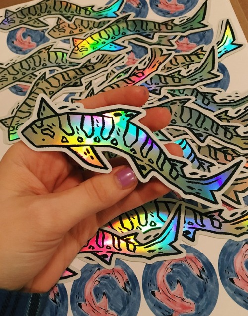 ghostparachutes:i made holographic shark stickers! i’m so in love!! they’re 5″ long and super reflec