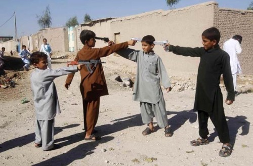 l84fashions:  Little boys play with toy guns in Afghanistan on the first day of Eid al-Adha.