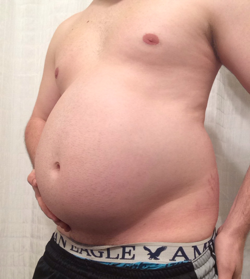 bellylover111:  So I obviously keep growing 😏  Im so stuffed and inflated… It hurts to move, I feel so huge and round! I decided to see how much i could eat tonight and then seeing and feeling the massive size of my giant gut decided ‘hey why not