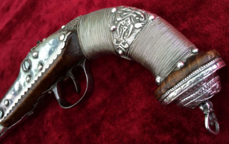 A British military pistol with silver mountings, originates from the Caucuses, 19th century.from And