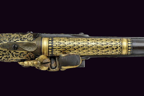 peashooter85:Gold decorated flintlock pistol originating from Northern Italy, early 18th century.