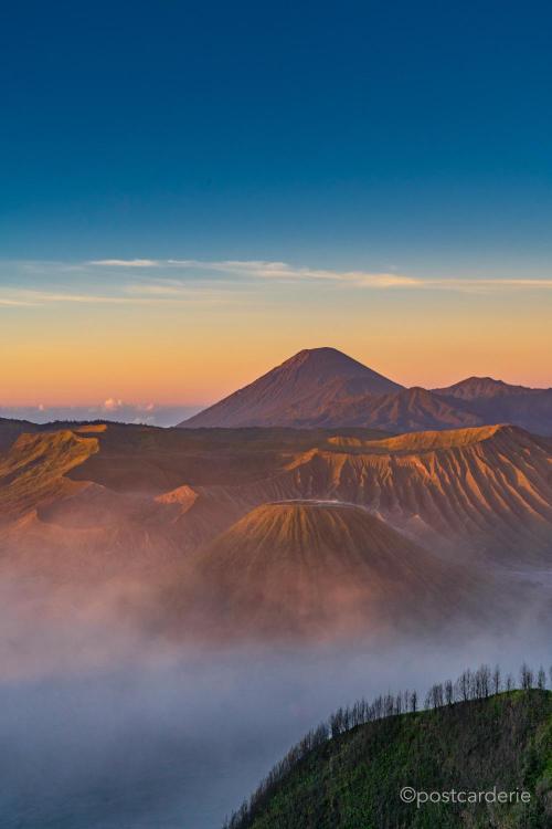 amazinglybeautifulphotography:  [OC] Sunrise over the Bromo caldera and Mt. Semeru, in Java, Indonesia (1000x1500) - Author: postcarderie on reddit