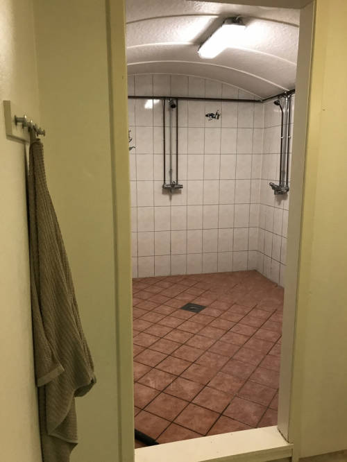 Men’s shower and bathroom at the Skydive Voss in Voss, Norway. It’s both a skydiving centre and host