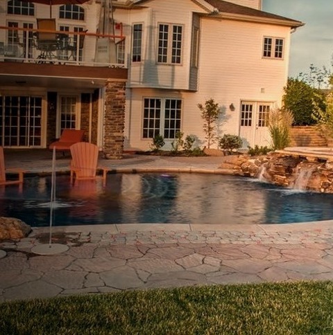 Contemporary PoolAn Example Of A Sizable Contemporary Backyard Fountain With A Lap Pool In The Shape