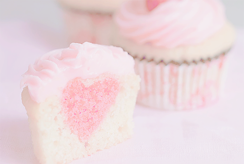 nigai:  Pink Heart-Filled Cupcakes with Strawberry Taffy Frosting (by Megan) 