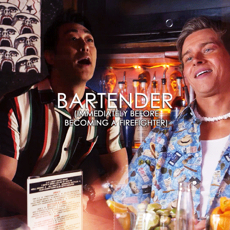 Gif 1: A blended gif of Chimney and Buck. On the left is Chimney in 2x12 in his striped bartender outfit, speaking to someone offscreen. On the right is Buck in 4x05 in his bartender outfit and with frosted tipped hair. He smiles and looks down. Overlayed over the gif in large white font is the word: "BARTENDER". Underneath in smaller font is: "(IMMEDIATELY BEFORE BECOMING A FIREFIGHTER)"