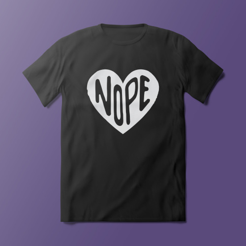 NOPEa white heart with the words “nope” written in it, displayed on a black shirtGet this here as mu