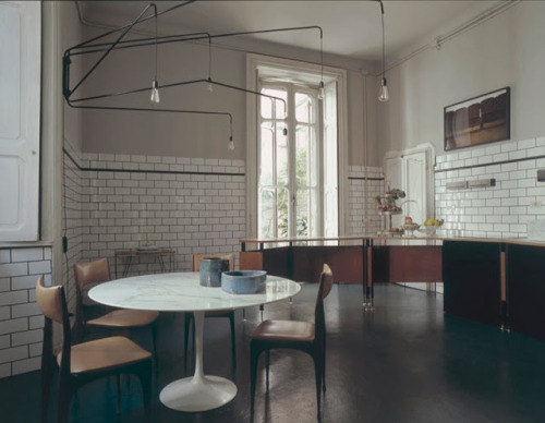 Milan by Dimore Studio. Dining table with marble top by Eero Saarinen.