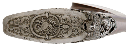 A heavily engraved and chiseled percussion muzzleloading rifle crafted by Giacomo Rinzi of Milan, ci