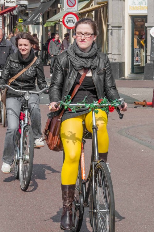 Nice upskirt of a woman cycling in yellow opaque pantyhose.Woman in pantyhose