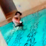 one-harrystyles:  Harry half naked in the pool flipping his hair x 