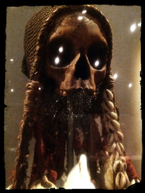 Skull Reliquary. Gulf of Papua. 19th Century. Human skull, string, shell, trade cloth, rattan. Objec