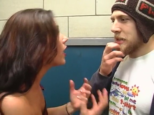 A+ thrift store shirt and goofy hat game from Bryan Danielson.