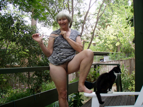 jemcasey:  Lyn, our lovely Australian granny gets naked on the deck…   Who could resist bending her over that rail and giving her hairy cunt a thorough drilling? Even though pussy seems indifferent to mistress’s charms!