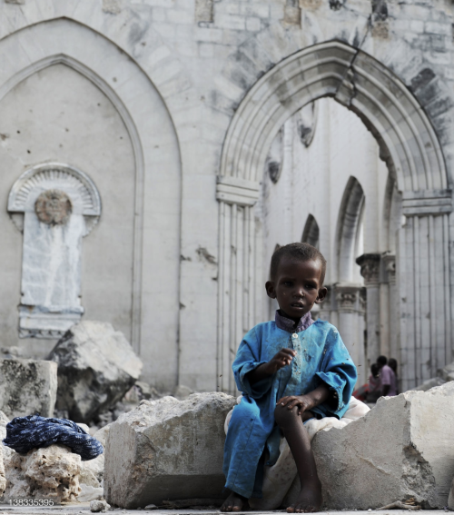 A Somali boy sits in the ruins of the Mogadishu Cathedral on August 18, 2011. The Cathedral was dest