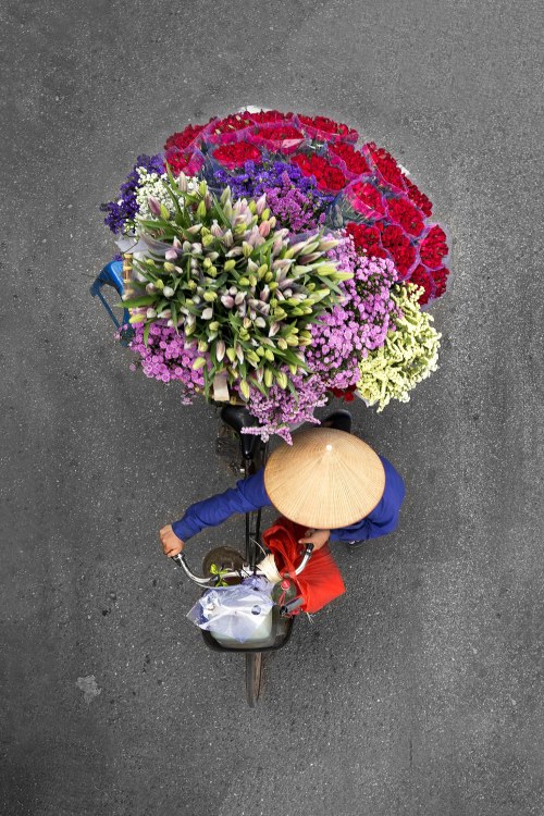 wired:The streets of Hanoi teem with bicycles, many of them ridden by street vendors carrying fruit 