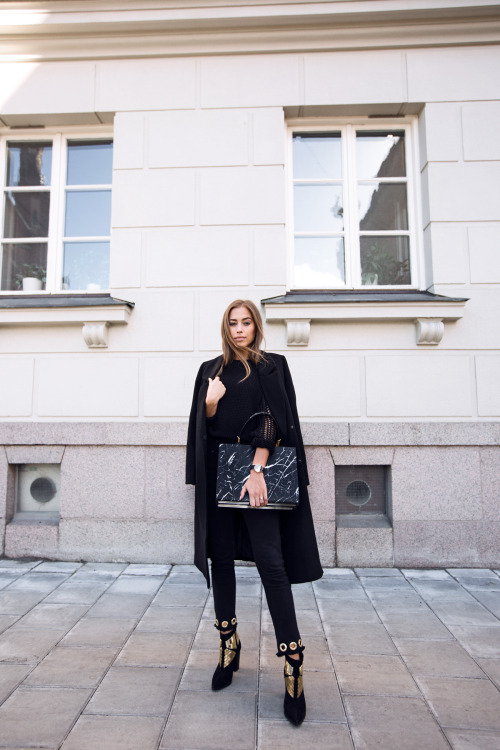 Kenza Zouiten in Classic Black.Pants, coat and Boots from Ivyrevel’s Bag from Balenciaga