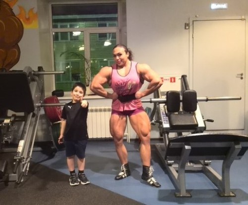 zimbo4444:  ..Natalia Trukhina..”The World’s Most Muscular Woman”..super strong & super beautiful & only 24yo..slightly over 5'5” tall 211 lbs & has over 18″ biceps.. 💪🏼😺👍🏼 ..Jr. proudly says..”my Mom can beat up