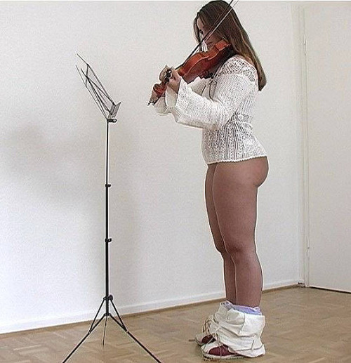 peachstripe:Violin Practice A young lady is learning to play the violin, her teacher as taken down h