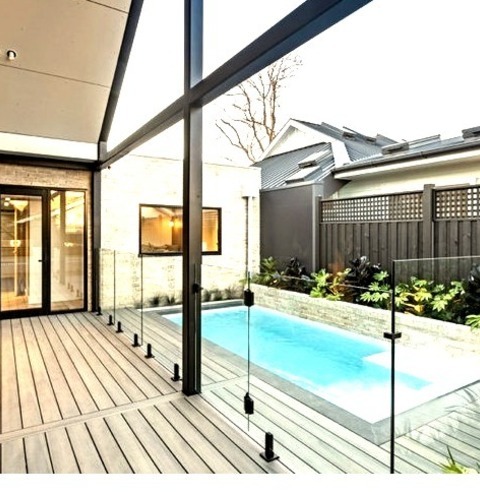 Melbourne Roof Extensions DeckPhoto Of A Ground-level Metal Railing Deck In A Modern Backyard That Has