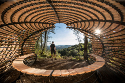 dezeen:  Shingles inscribed with personal messages cover this squat hilltop pavilion, created by British designer Giles Miller as a rest stop for ramblers » 