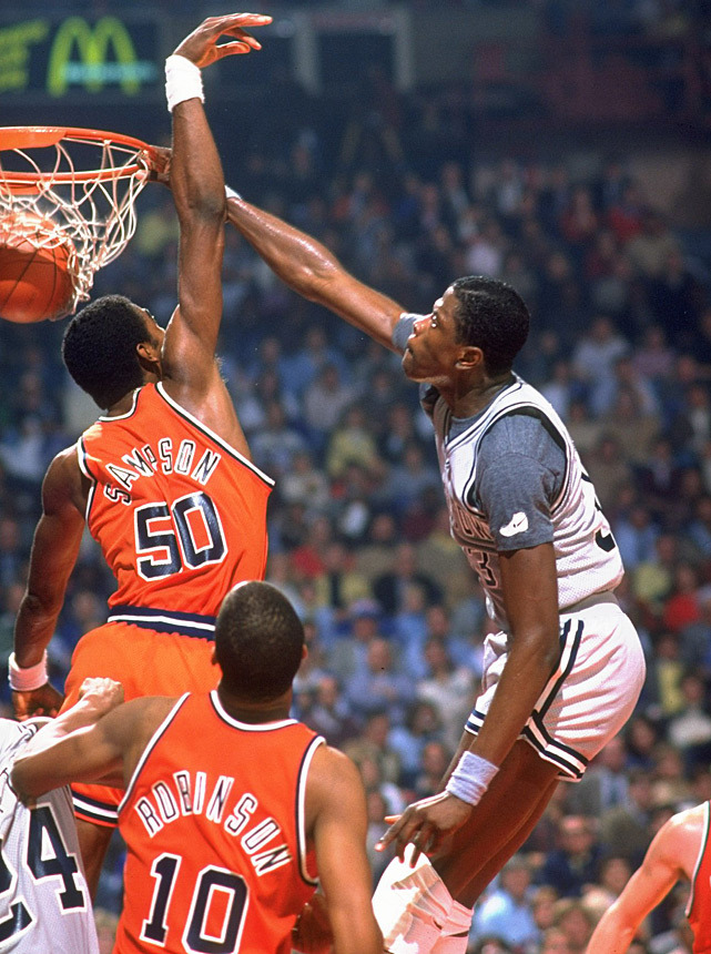 siphotos:   Patrick Ewing dunks on Ralph Sampson during a 1982 Georgetown-Virginia