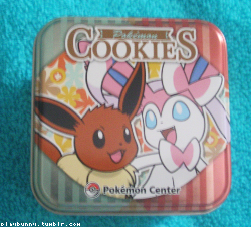 guys look, i finally got a thing i’ve been searching for for months now, this Sylveon cookie tin ! And it has a Sylveon head shaped sugar cookie in it too !! So cute     