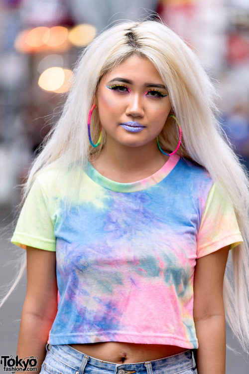 22-year-old Yuu on the street in Harajuku with rainbow eye makeup, an ANAP tie-dye crop top, F21 cut